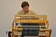 Tom Hobbs weaving with Baby Wolf Loom
